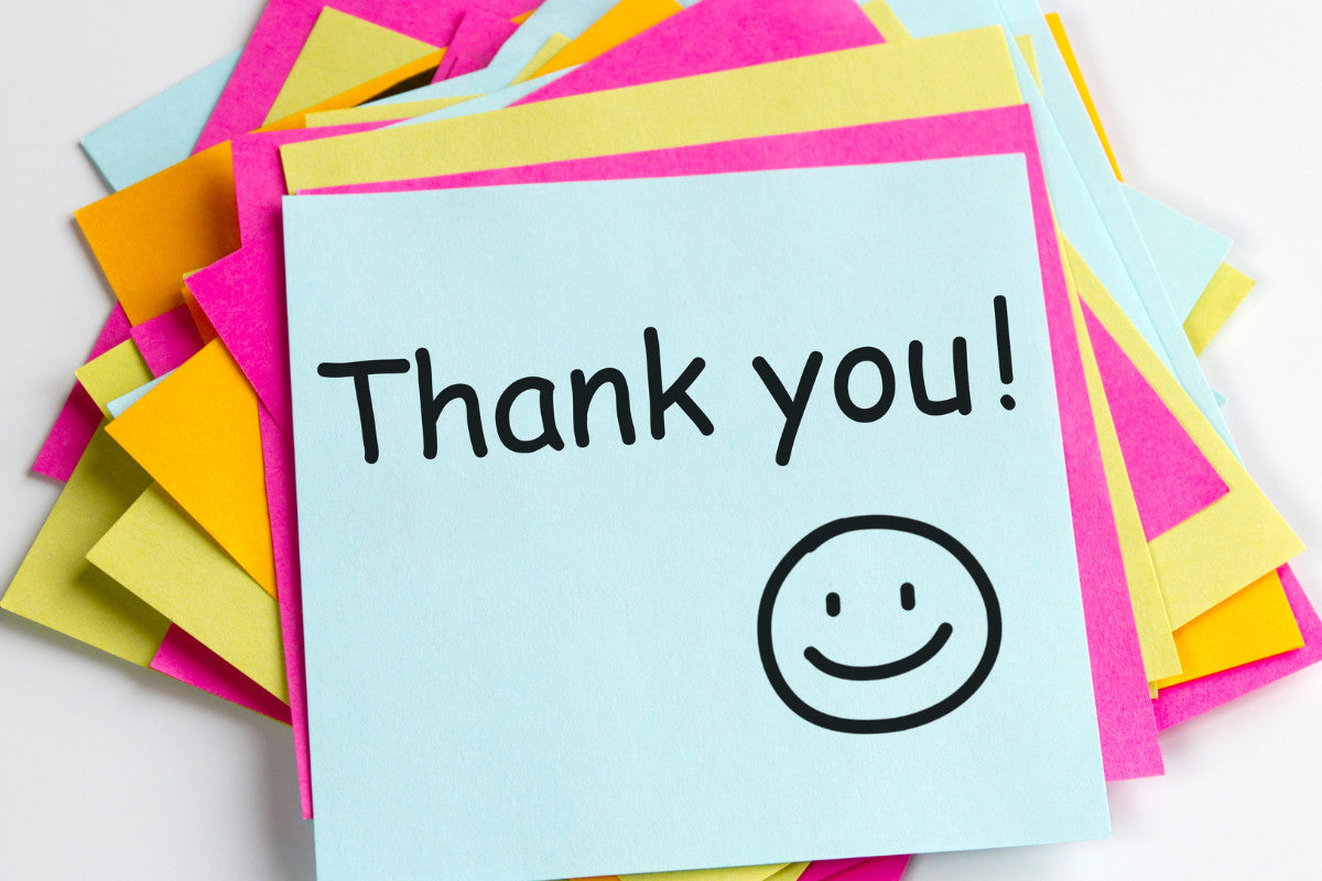 bright pink, yellow, and pale blue sticky notes stacked on top of one another. the words