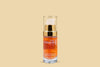 Noche's Vitamin C Serum standing alone on a light orange background.